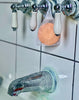 clarity shower soother hanging on bath faucet orange