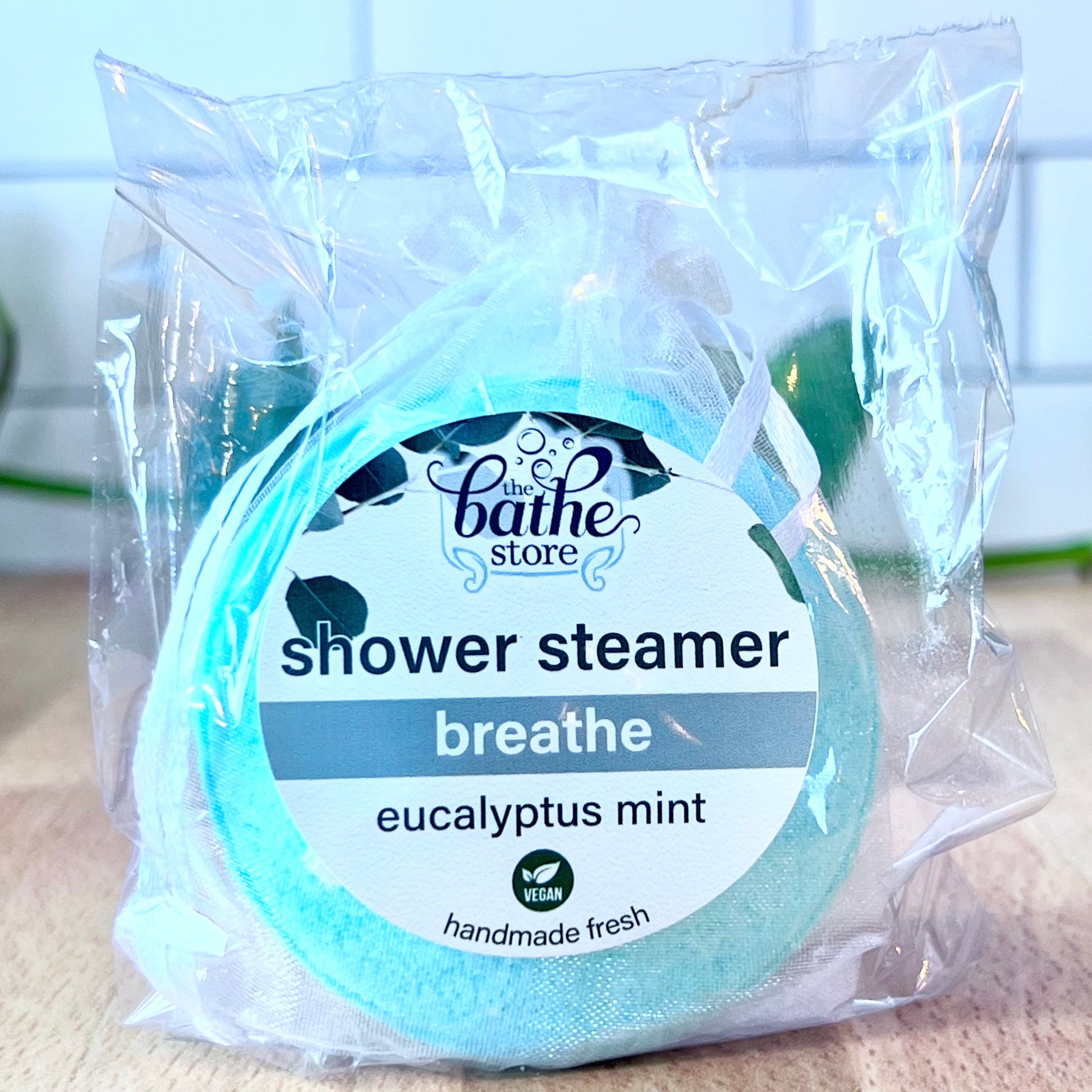 shower steamer breathe eucalyptus mint green in packaging